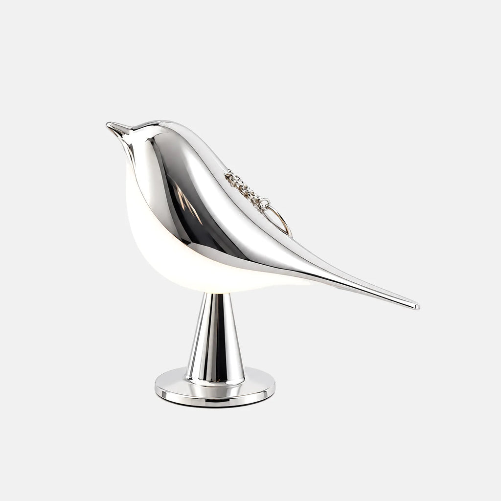 Lampe oiseau tactile Claris argentée, sur fond uni