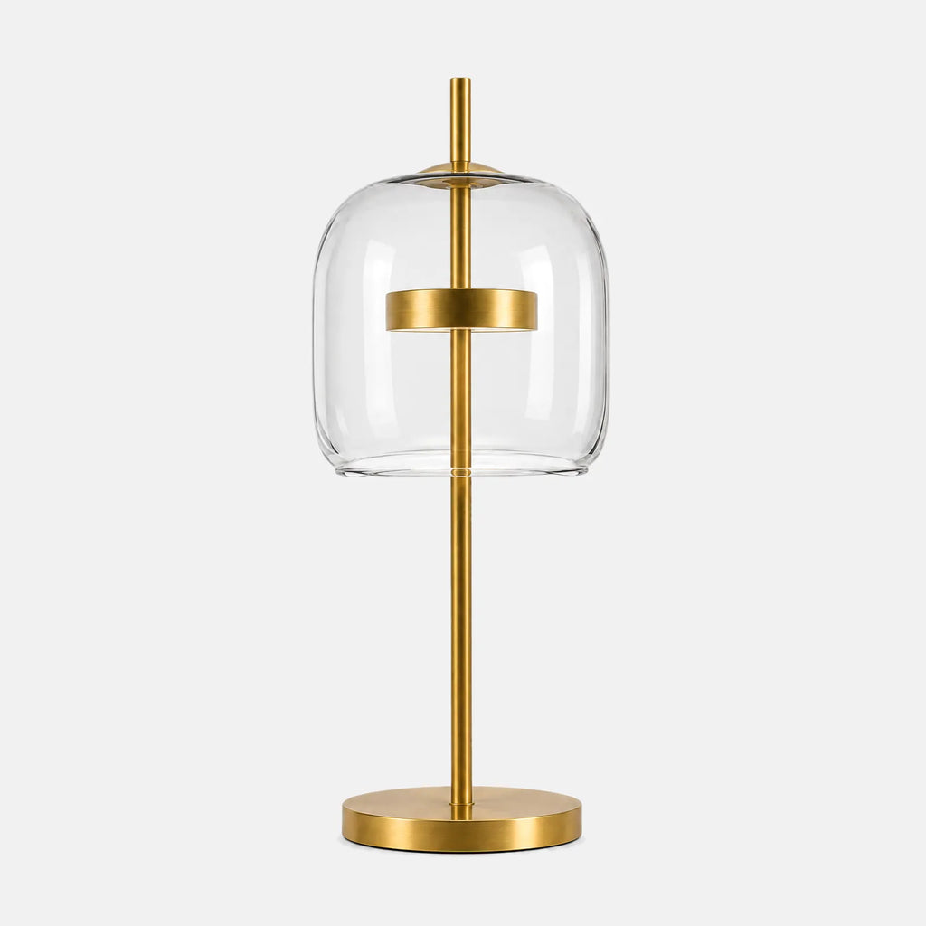 Lampe de table en verre Lumio, verre transparent et pied en laiton, sur fond uni