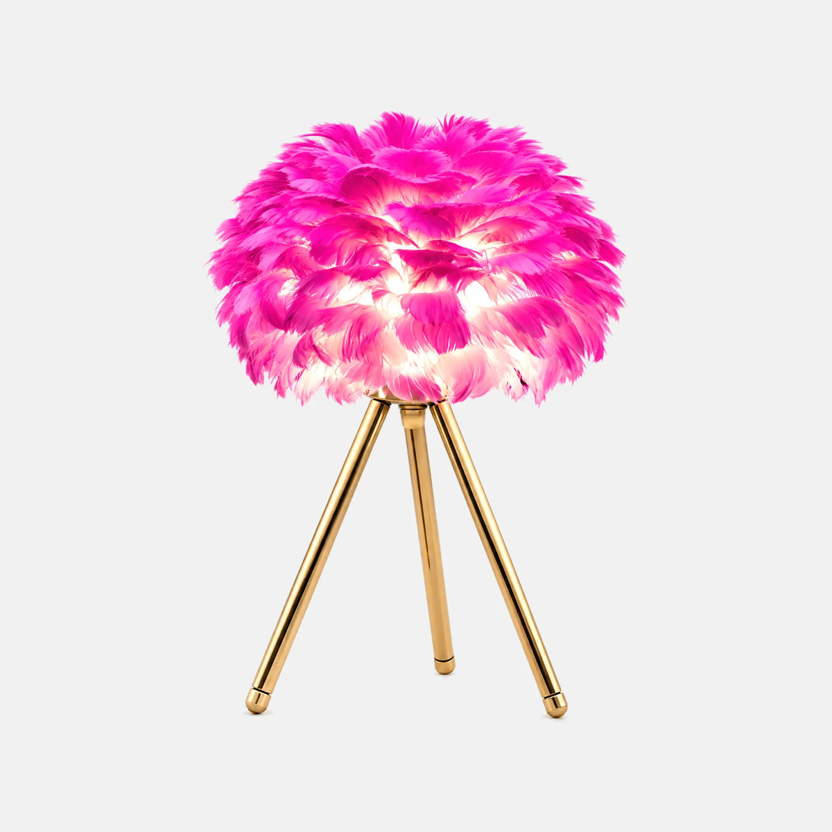 Lampe de table plume Plumo rose fuchsia sur trépied doré, sur fond uni