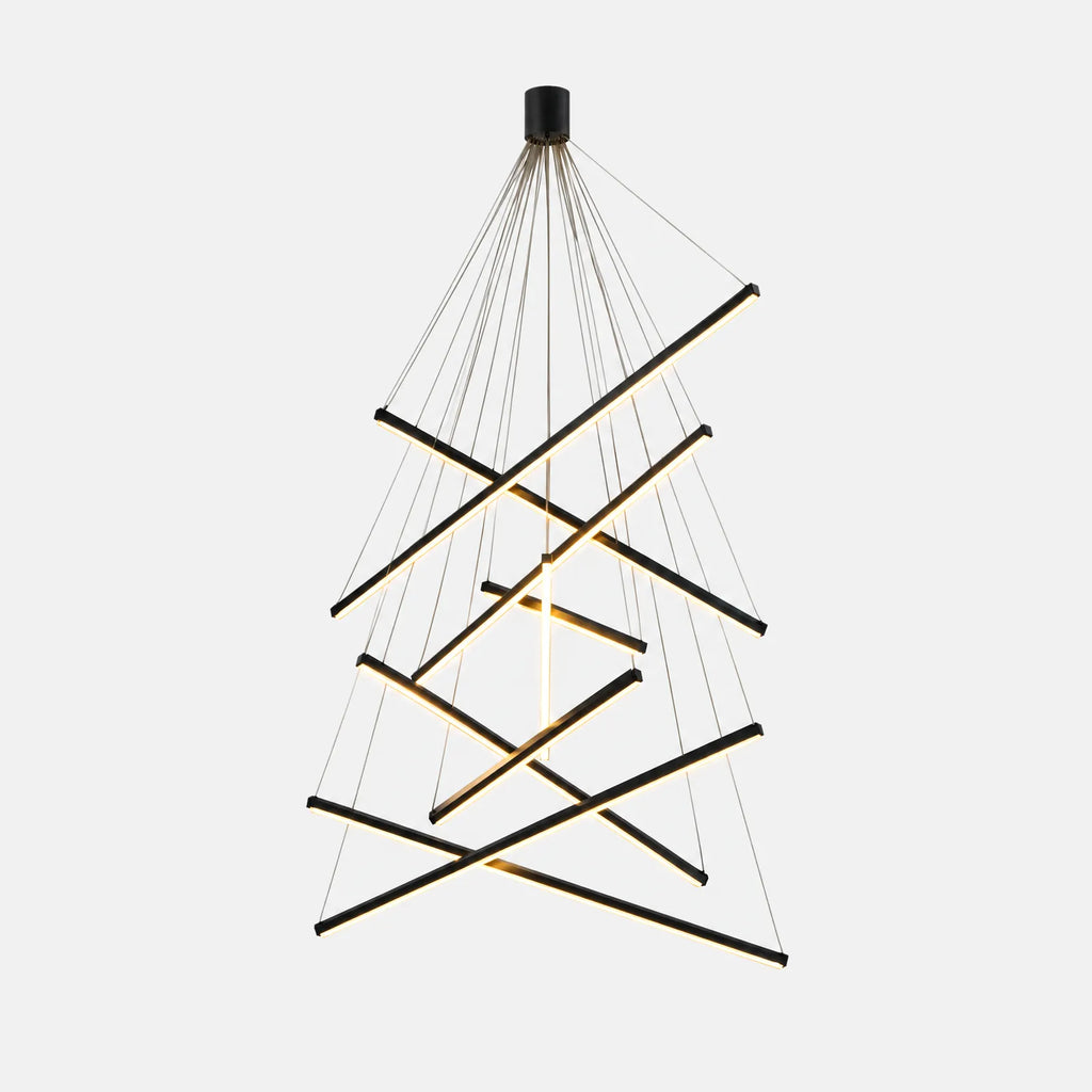 Lustre LED Stela à baguettes croisées noires et dorées, sur fond uni