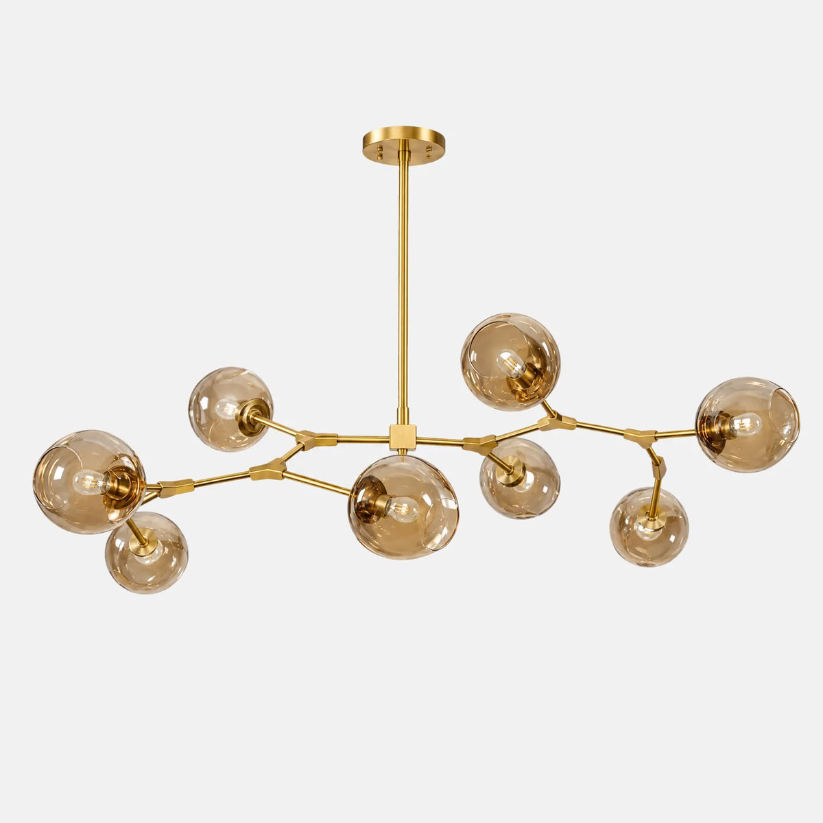 Lustre suspension verre Hora doré, bras ramifiés et globes en verre ambré, photo sur fond uni