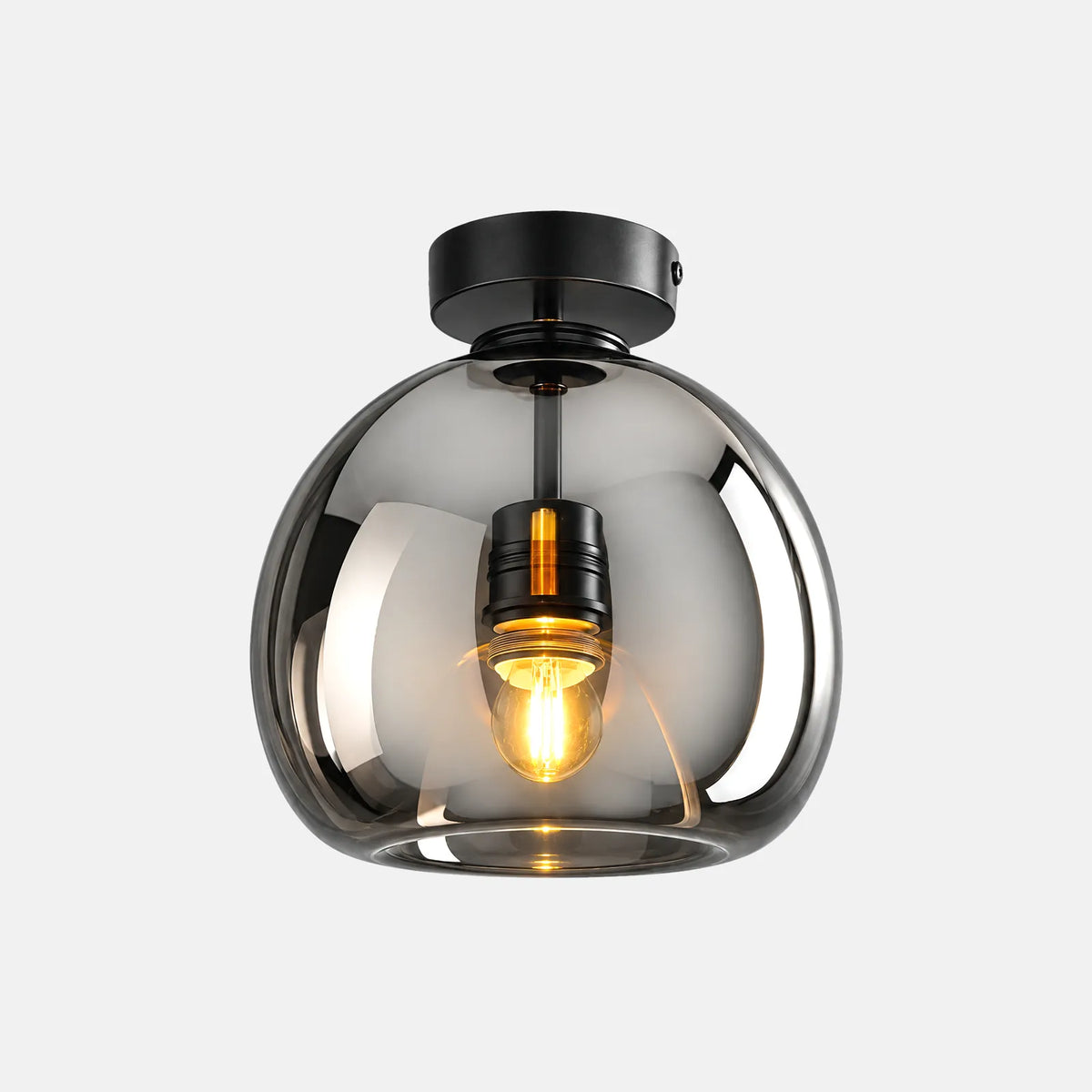 Plafonnier en verre Rita gris fumé, globe soufflé et fixation noire, sur fond uni