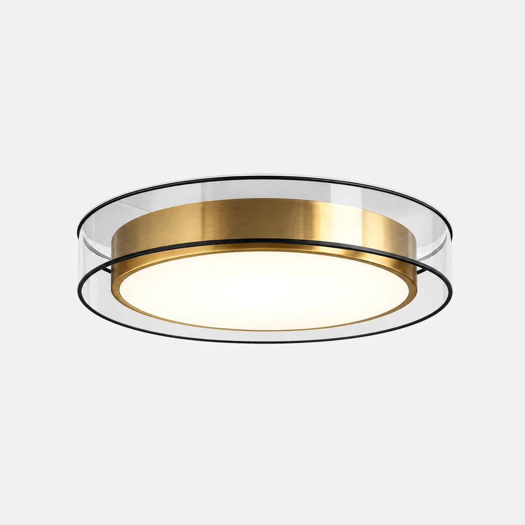 Plafonnier Luxia, tambour doré et anneau en verre transparent, sur fond uni