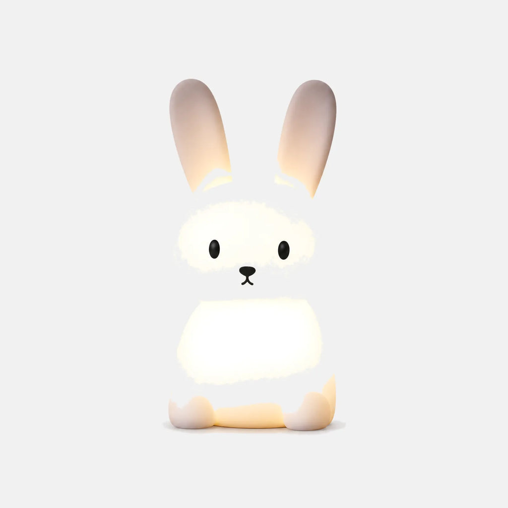 Veilleuse lapin en silicone Avio allumée, sur fond uni