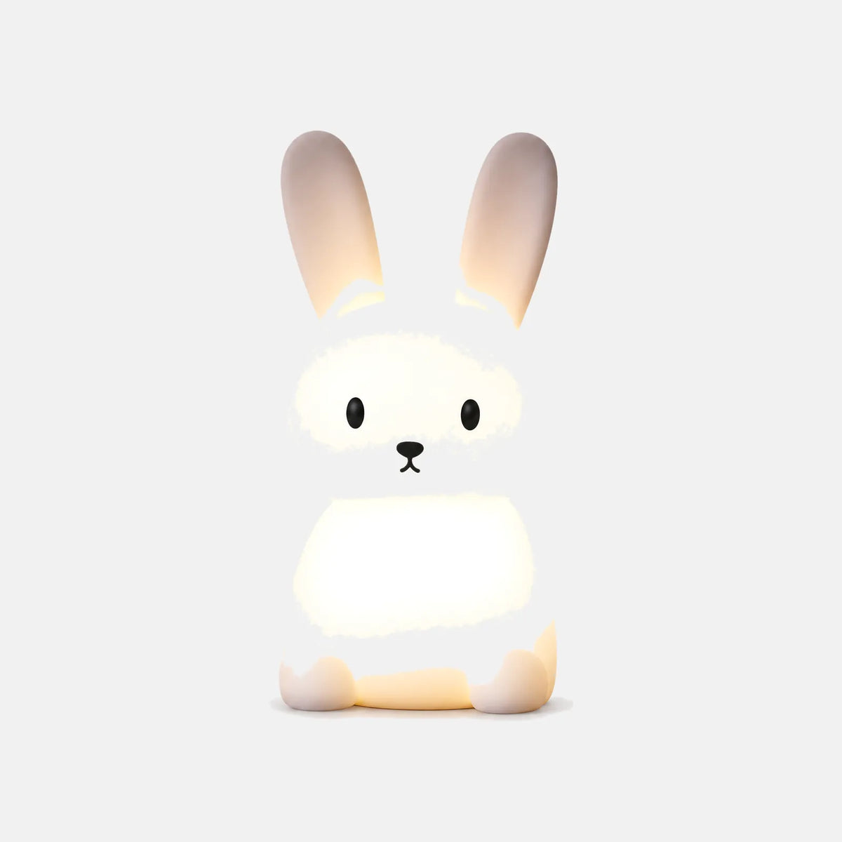 Veilleuse lapin en silicone Avio allumée, sur fond uni